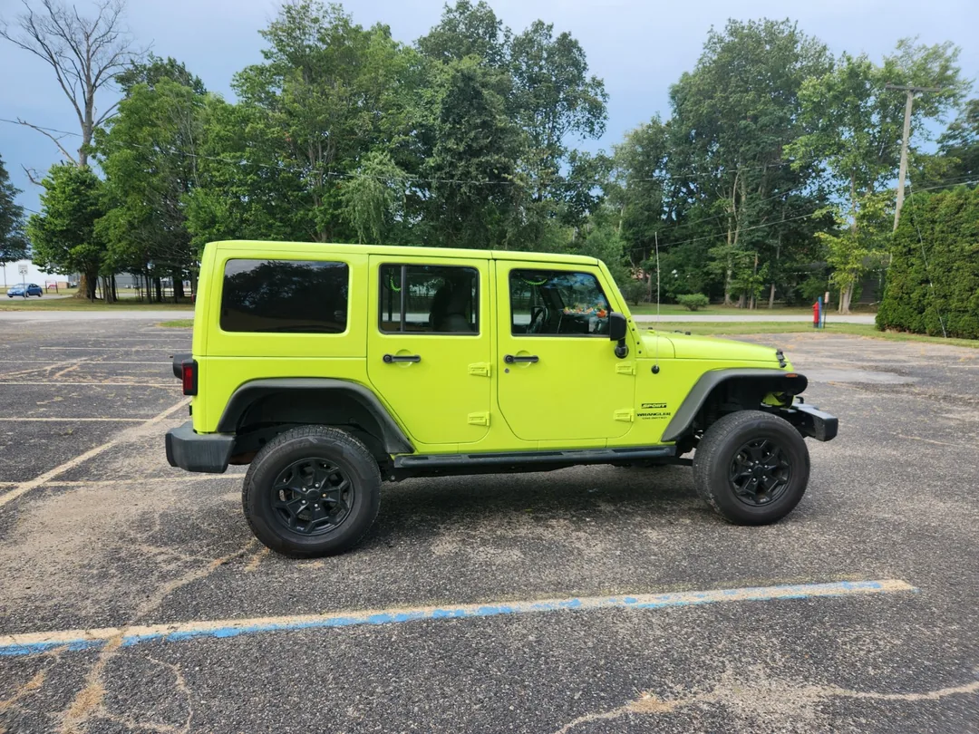 Side view of the actual Hyper Green Jeep Wrangler JK Unlimited with its hardtop.